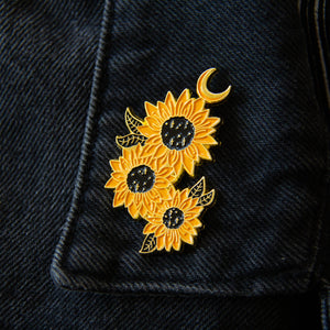 A gold flower lapel pin for women's witchy and spiritual nature fashion.