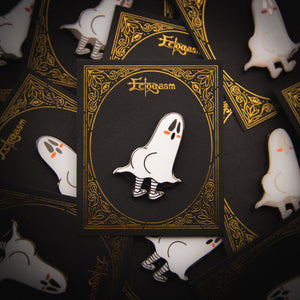 A gothic Ectogasm enamel pin on a black and gold card for wholesale. 