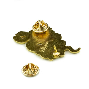 Gold clasps on the back of a cool snake lapel pin for unique fashion.