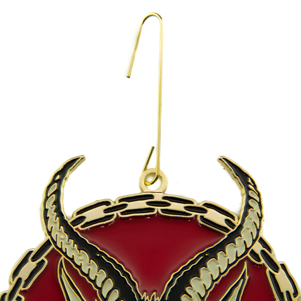 Gold hook on the top of a Krampus Christmas ornament for tree decorations.