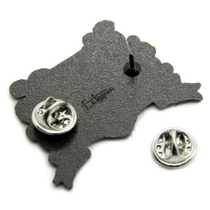 Two metal clasps on the back of an Ectogasm lapel pin. 
