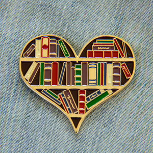 Library book shelf enamel pin in gold.