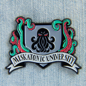 A unisex H.P. Lovecraft themed pin with tentacles and the Miskatonic University crest. 