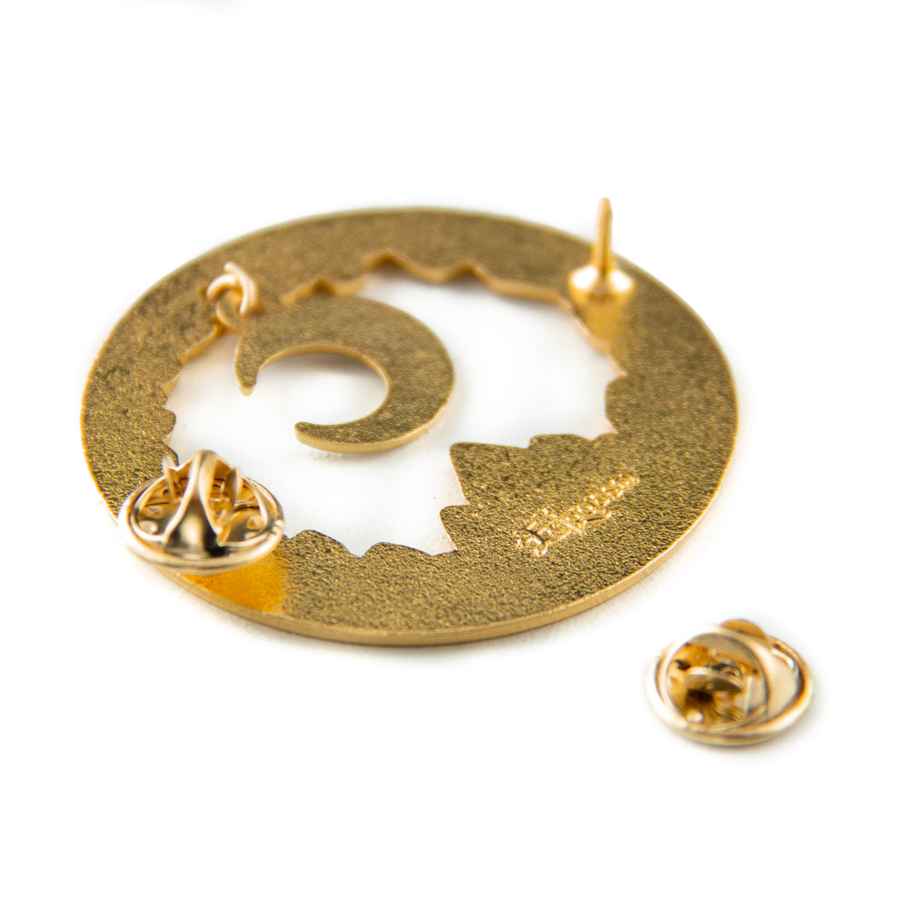 Metal clasps on the back of a celestial brooch for lovers of astrology and space.